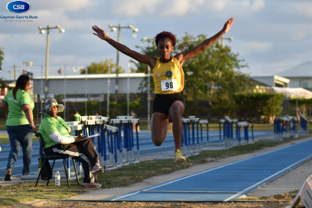 Aijah Lewis leaps to the gold.